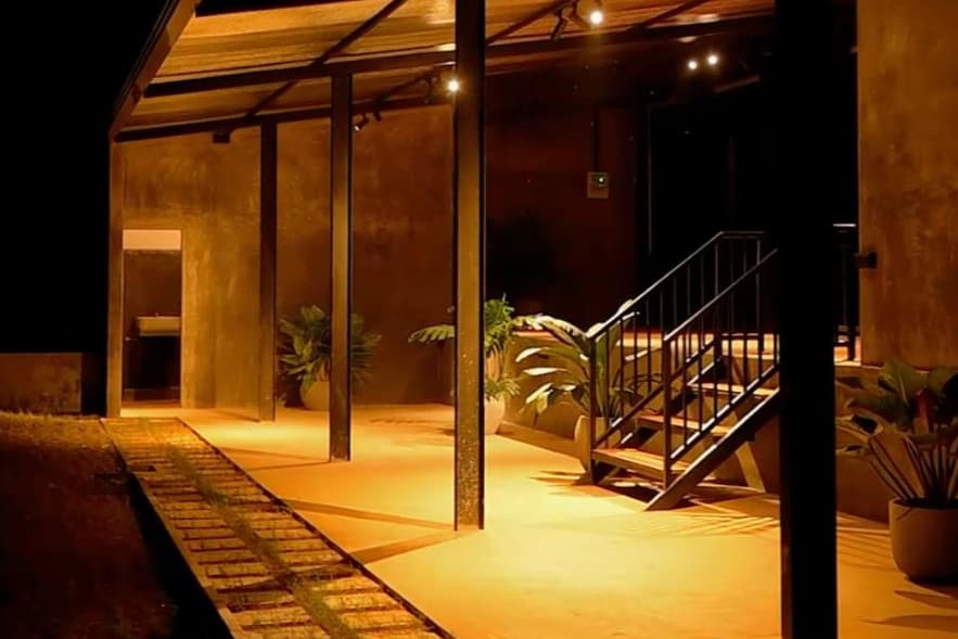 The Crickpitch pavilion lit up at night
